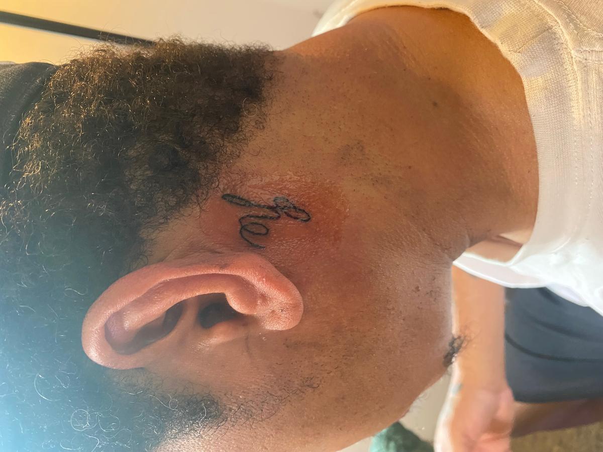 Face script tattoo